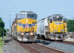 A rock train and a local wait to head west